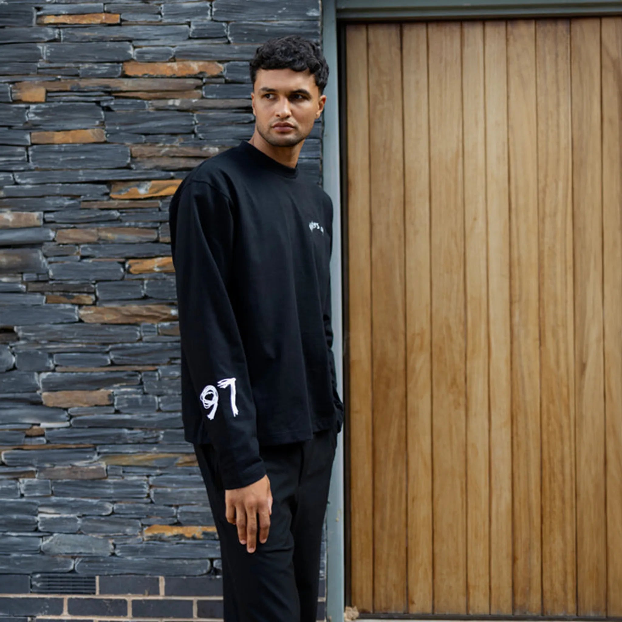 Model side view of Players Only Players Club L/S Black T-Shirt